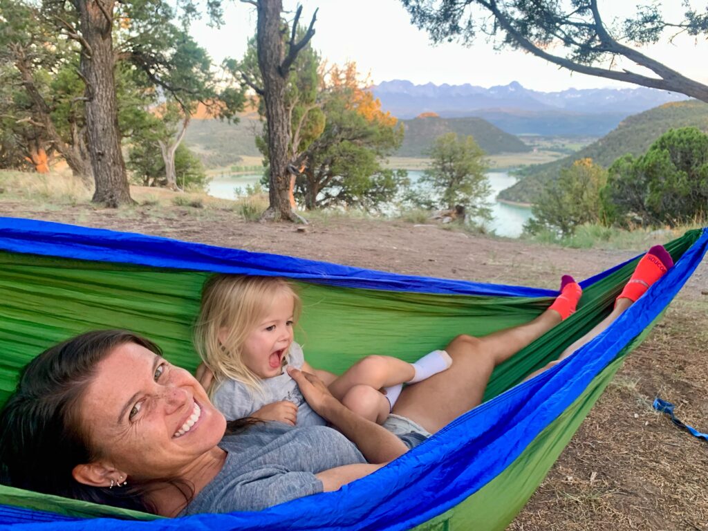 hammock with a toddler and mountain view