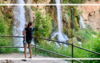 mom and toddler looking at waterfalls