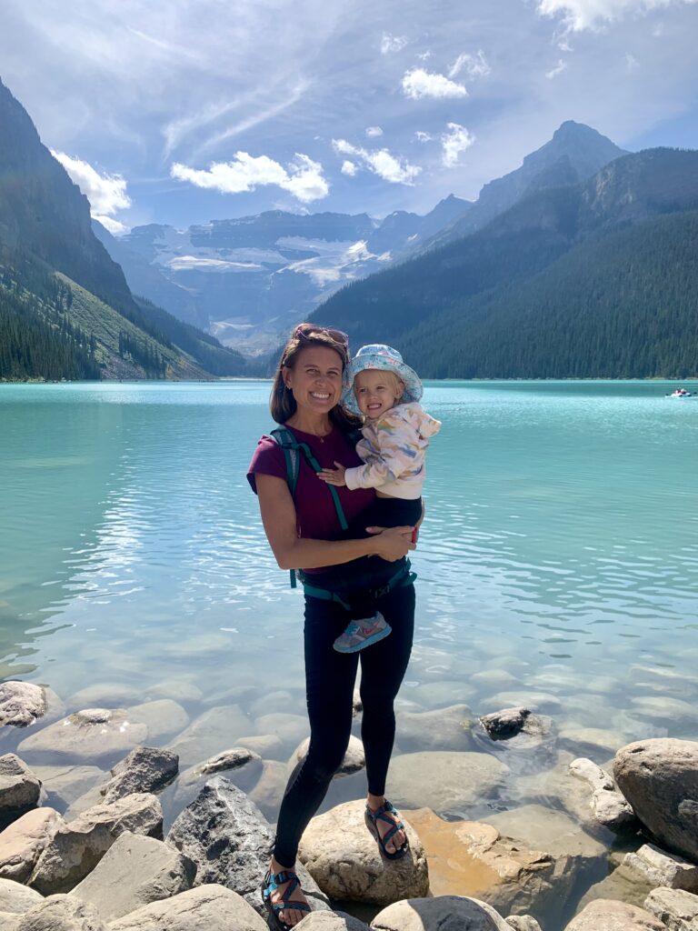 Mom and toddler in front of Lake Louise Banff